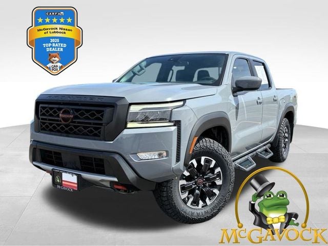 2022 Nissan Frontier PRO-4X in Boulder Gray Pearl — front three-quarter view