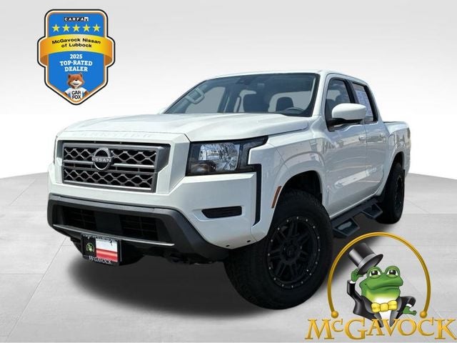 2024 Nissan Frontier SV in Glacier White — front three-quarter view